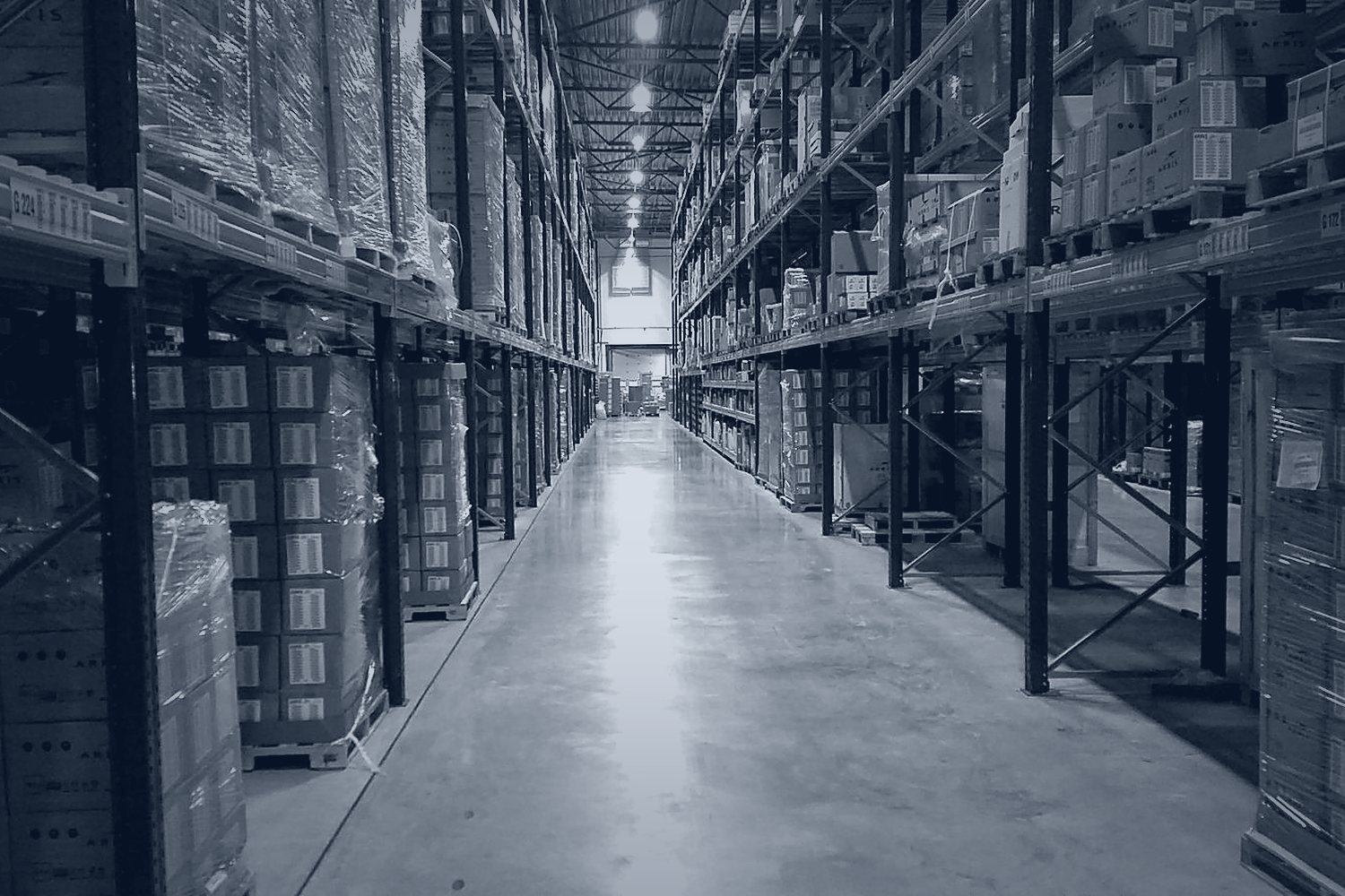 Warehouse aisle with racking and staged freight